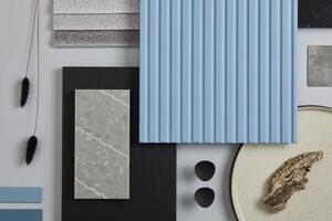 Flat lay composition of stylish architect moodboard with samples of textile, paint, blue wooden lamella panels and tiles. White, black, blue and light grey color palette. Copy space. Template. photo