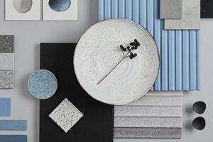 Flat lay composition of stylish architect moodboard with samples of textile, paint, blue wooden lamella panels and tiles. White, black, blue and light grey color palette. Copy space. Template. photo