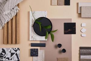 Creative flat lay composition of interior designer and architect moodboard. Textile and paint samples, lamella panels and lastrico tiles. Beige, black and green color palette. Copy space. Template. photo