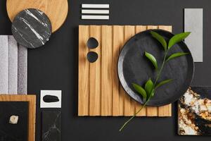 Stylish flat lay comosition of creative architect moodboard with black, beige and grey samples of textile, paint, wooden lamella panels and marble tiles. Top view. Copy space. Template. photo