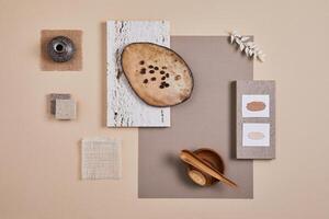 Creative flat lay composition with textile and paint samples, panels and cement tiles. Stylish interior designer moodboard. Light beige color palette. Copy space. Template. photo