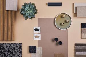Creative flat lay composition of interior designer and architect moodboard. Textile and paint samples, lamella panels and lastrico tiles. Beige, black and green color palette. Copy space. Template. photo