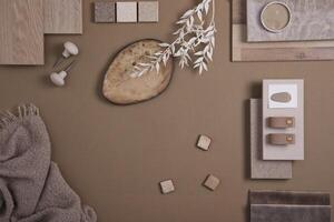 Flat lay of creative architect moodboard composition with samples of textile, paint, panels and tiles. Natural materials. Beige and brown color palette. Top view. Copy space. Template. photo