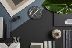 Elegant flat lay composition of interior designer moodboard with textile and paint samples, panels and tiles. Black, blue, beige and dark grey color palette. Copy space. Template. photo