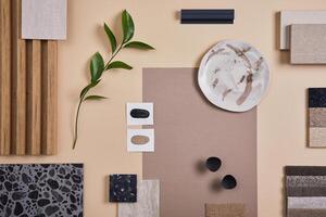 Creative flat lay composition of interior designer and architect moodboard. Textile and paint samples, lamella panels and lastrico tiles. Beige, black and green color palette. Copy space. Template. photo