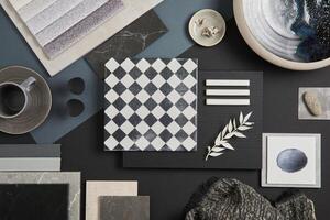 Flat lay of stylish architect moodboard composition with black, beige and grey samples of textile, paint, panels and tiles. Top view. Copy space. Template. photo