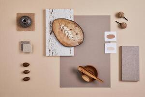 Creative flat lay composition with textile and paint samples, panels and cement tiles. Stylish interior designer moodboard. Light beige color palette. Copy space. Template. photo