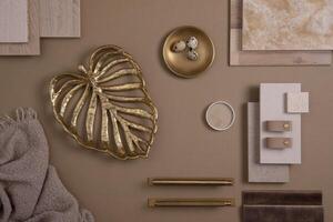 Creative flat lay composition with textile and paint samples, panels and tiles. Stylish interior designer moodboard. Golden and dark beige color palette. Copy space. Template. photo