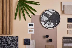 Creative flat lay composition of interior designer and architect moodboard. Textile and paint samples, lamella panels and lastrico tiles. Beige, black and green color palette. Copy space. Template. photo