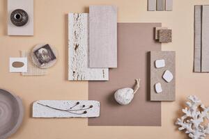 Creative interior designer moodboard. Flat lay composition with textile and paint samples, panels and cement tiles. Beige and grey color palette. Copy space. Template. photo