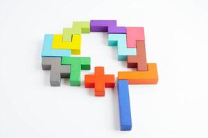 Logical thinking and problem solving problem solution creative business concept, wooden puzzle geometric block shape. photo