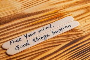 Positive thoughts for increasing selfesteem on wooden posts on wooden background photo