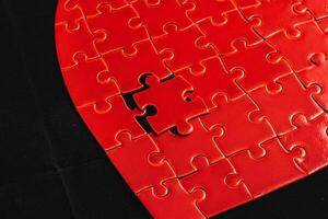 Concept of unrequited feelings, heart puzzle with missing element photo