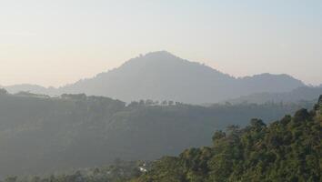 Noise and not focus images. photo of mountains and blue sky in the morning. Sunrise over the hills
