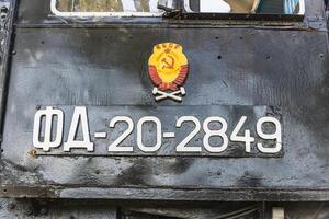 Text and numbers on a metal surface with the symbols of the USSR for design and commercial use photo
