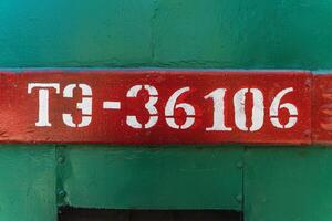 Text and numbers on a metal surface with the symbols of the USSR for design and commercial use photo