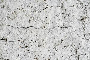 Earth with cracks top view for background or graphic design of textures and overlays with the concept of drought and death. photo