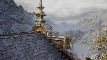 Mountain landscape with a rustic building and snowy peaks in the background video