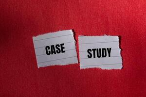 Case study message written on ripped torn paper piece with red background. Conceptual case study symbol. Copy space. photo