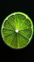 lime isolated on black background photo