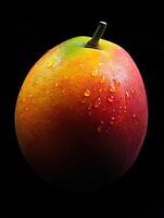 mango isolated on black background photo