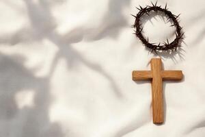 Holy Week Cross Crown of Thorns White Fabric Background photo