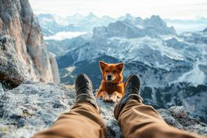 Hiker and his dog are enjoying a beautiful mountain view photo