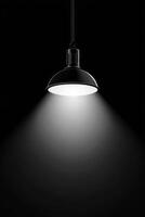 Hanging lamp illuminating dark room with bright light photo
