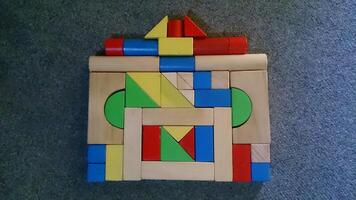 A wooden block with a colorful design on it photo