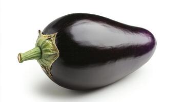 Pumpkin aubergine rests on a white backdrop, showcasing its smooth texture and deep purple hue photo