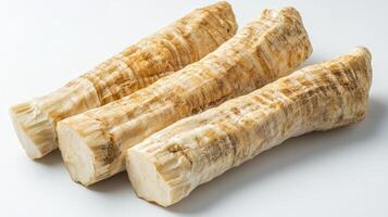 Three malanga pieces on a clean white background highlight their unique look photo