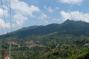 Panoramic Landscape View of lush hills. Hills that are still covered with lush forests. Wild natural scenery. Plateau area photo
