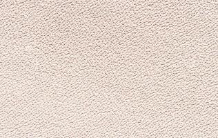 Textured beige surface with subtle grain patterns and fine details for design backgrounds. photo