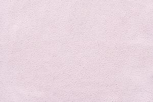 Light pink textured surface with subtle grain pattern for background or design. photo