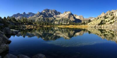 Serene Alpine Lake Reflecting Majestic Mountains Nature Landscape Photography photo