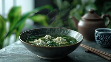 Delicious Wonton Soup with Spinach Sesame and Broth in a Modern Bowl photo