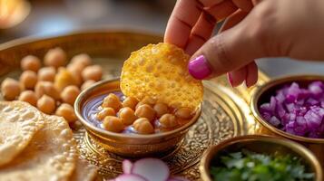 Delicious Pani Puri Crispy Flatbread Dipped in Chickpea Curry photo
