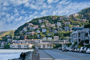 Houses on the hill with cloudy blue sky photo