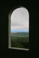 Mountain and sea view from frame of window photo