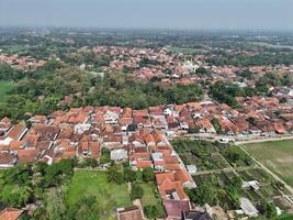 aerial view of a village in the countryside. rice fields around the village. photo
