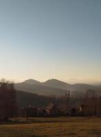 Autumn sunset in the mountains, autumn mountains, view from the top of the mountain. Sudetes, Poland photo