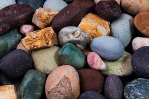 Sea pebbles, multicolored brown sea pebbles as a background. Background photo