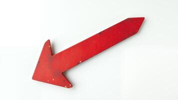 Red arrow pointing downwards on a white background photo