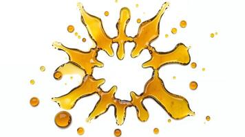 Abstract art created with amber liquid splashes on a white background photo