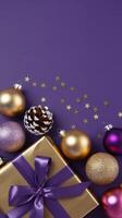 Purple and Gold Christmas Arrangement with Gift Box and Baubles on Purple Background. Elegant, Festive Christmas Banner, Template, Copy Space, Social Media Post photo