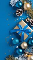 Light Blue and Gold Christmas Arrangement with Gift Box and Baubles on Light Blue Background. Elegant, Festive Christmas Banner, Template, Copy Space, Social Media Post photo