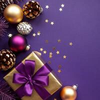 Purple and Gold Christmas Arrangement with Gift Box and Baubles on Purple Background. Elegant, Festive Christmas Banner, Template, Copy Space, Social Media Post photo