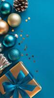 Light Blue and Gold Christmas Arrangement with Gift Box and Baubles on Light Blue Background. Elegant, Festive Christmas Banner, Template, Copy Space, Social Media Post photo