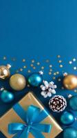 Light Blue and Gold Christmas Arrangement with Gift Box and Baubles on Light Blue Background. Elegant, Festive Christmas Banner, Template, Copy Space, Social Media Post photo