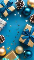 Light Blue and Gold Christmas Arrangement with Gift Box and Baubles on Light Blue Background. Elegant, Festive Christmas Banner, Template, Copy Space, Social Media Post photo